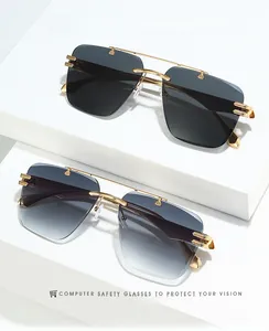 Detail of rimless sunglasses with gold metal temples and gradient lenses on white cubes