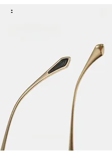 Detail of curved golden metal temples with black tips for comfortable sunglasses wear