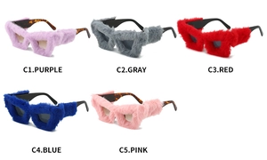Flat lay of creative cat eye sunglasses featuring colorful plush faux fur frames