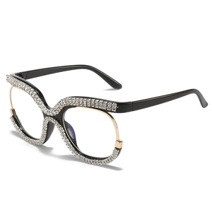 Montatura occhiali cat-eye oversize in nero e oro con strass e cristalli brillanti