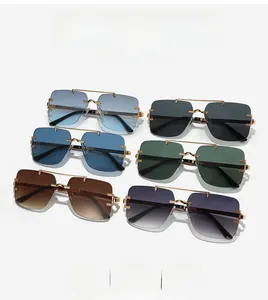 Detail of six frameless square sunglasses featuring gradient lenses and gold metal bridges