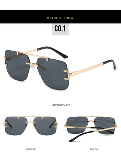 Detail view of rimless square sunglasses with hollow gold metal temples and dark gray lenses