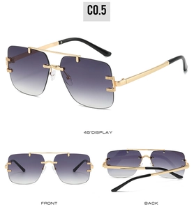 Detail view of purple gradient rimless sunglasses with engraved gold metal temples