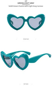 Détail des lunettes de soleil cœur bouffantes vert sarcelle C7 avec verres gris clair, deux angles