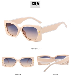 Square sunglasses with peach thick frames, star accents, and gradient lenses detail view