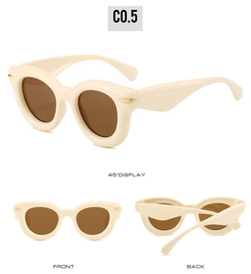 Three perspectives of beige oval puffy sunglasses with brown lenses and golden rivets