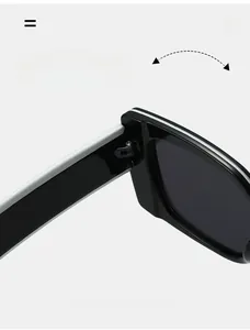 Macro view of durable metal hinge on square sunglasses with black and white contrast
