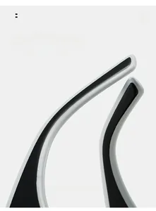 Detail of ergonomic curved sunglasses temple in black and white contrast design