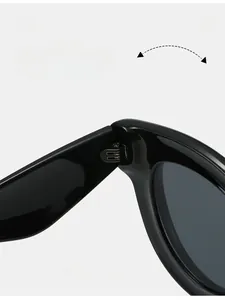 Macro shot of durable metal hinges on glossy black oval puffed sunglasses for women and men