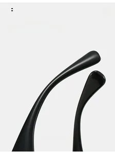 Macro shot of curved black glossy sunglasses temples with smooth polished finish