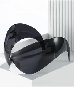 Macro detail of oversized wraparound sports sunglasses on white geometric stone