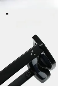Macro view of triple metal rivets on thick black polygon sunglasses frame temples