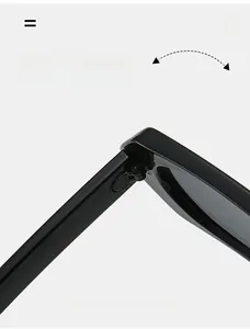 Close-up of reinforced hinges on black polygon sunglasses for durability