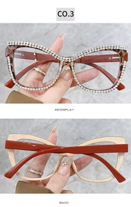 Detail view of cat eye glasses with hand-set crystal chain and tortoiseshell frames