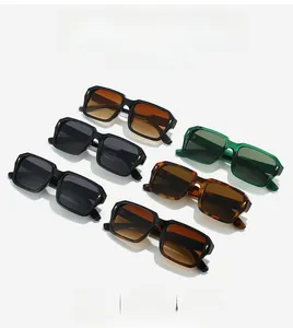 Detail view of square sunglasses showing vintage thick frames and stylish metal rivet accents