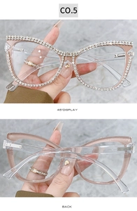 Detail view of cat eye frame with luxury hand-set crystal chains and champagne gold finish