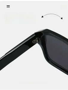 Detail of durable metal hinge on classic black square sunglasses with reinforced texture