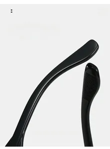 Detail of curved black sunglasses temples with anti-slip texture for comfort