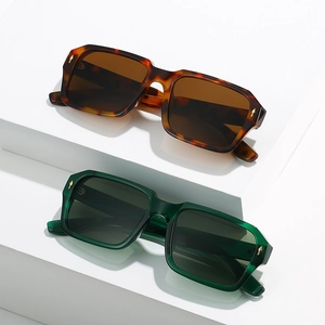 Classic square sunglasses in tortoise shell and dark green frames with gold arrow rivets