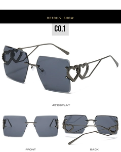 Détails de lunettes de soleil sans monture avec verres gris et branches en métal évidé