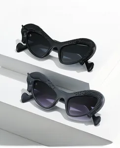 Close-up of stylish cat-eye sunglasses with detailed horse head relief on the frames