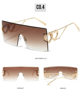 Drei Ansichten der übergroßen randlosen Sonnenbrille mit goldenen Doppelherz-Bügeln