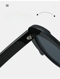 Detailed close-up of a durable metal hinge on stylish black cat eye sunglasses