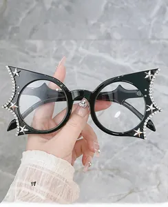 Detail of bat-wing glasses frame with hand-set rhinestones and silver star accents