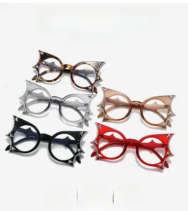 Flat lay of star-rhinestone bat glasses in tortoise, gray, amber, and red frames