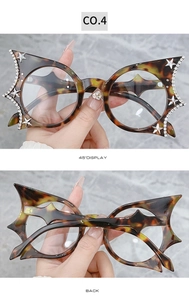 Close-up of leopard cat eye frame with sparkling rhinestones and metal stars detail