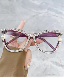 Detail of luxury cat-eye glasses with hand-set diamonds, pearls and blue light blocking lens