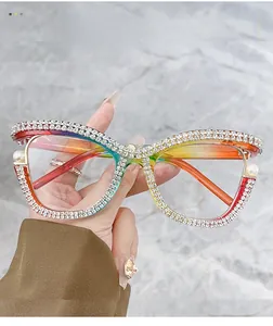 Detailed view of rainbow gradient frames with hand-set rhinestones and white pearls