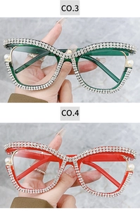 Detailed view of cat-eye frames with hand-set rhinestones and white pearls in green and red