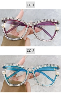 Detail view of luxury oversized glasses with rhinestones and pearls in purple and blue