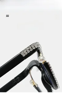 Macro detail of luxury oversized glasses frame with double-row rhinestones and pearls