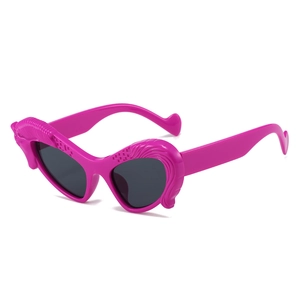 Pink wing-shaped cat-eye sunglasses with dark lenses shown in a 45-degree angle
