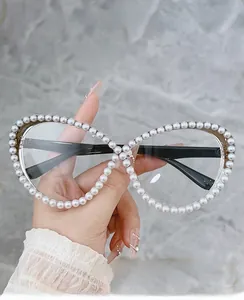 Detail of cat eye glasses frame with hand-set pearls and computer protection lenses
