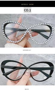 Macro detail of infinity frame with white faux pearls on black rhinestone glasses