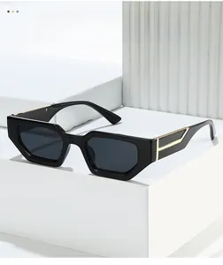 Detail of black square frame sunglasses featuring bold golden geometric temple decor