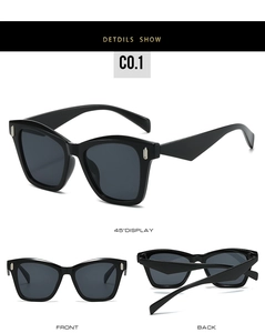 Detailed views of black cat-eye sunglasses with gold U-shaped metal accents and dark lenses