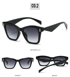 Cat eye sunglasses detail showing silver metal temple accents and grey gradient lenses