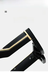 Macro detail of flexible black frame with iconic gold T-shaped hinge on premium sunglasses