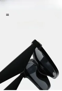 Detail of durable hinges and flexible temples on these minimalist black cat eye sunglasses