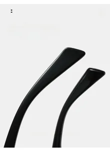 Close-up of curved glossy black temple tips for comfortable wear on cat eye sunglasses