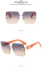 Detail view of rimless gradient sunglasses with camellia flower metal trim and orange arms