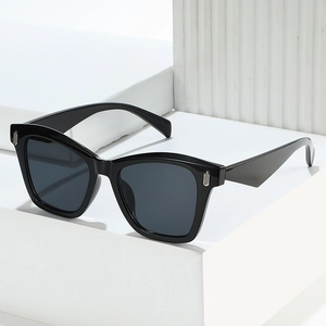 Classic black oversized cat-eye sunglasses with silver metal rivets and thick frames