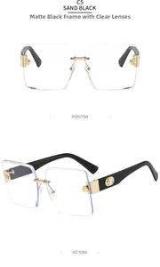 Detail view showing sand black frameless lenses and gold circular temple ornaments