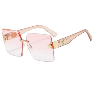 Rimless square sunglasses with pink gradient lenses and gold rose detail for women
