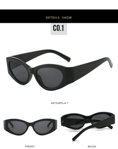Detailed views of vintage black cat-eye sunglasses with wide temples and dark lenses
