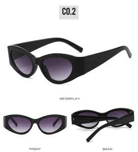 Detailed views of vintage cat-eye sunglasses with thick black frames and purple gradient lenses
